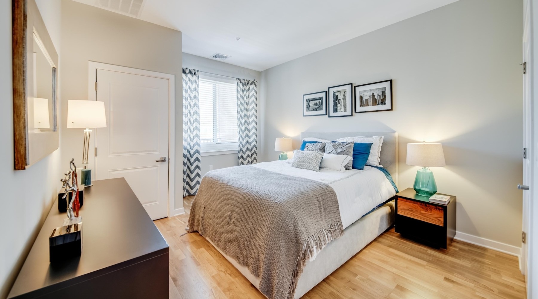 a bedroom with a bed and two nightstands