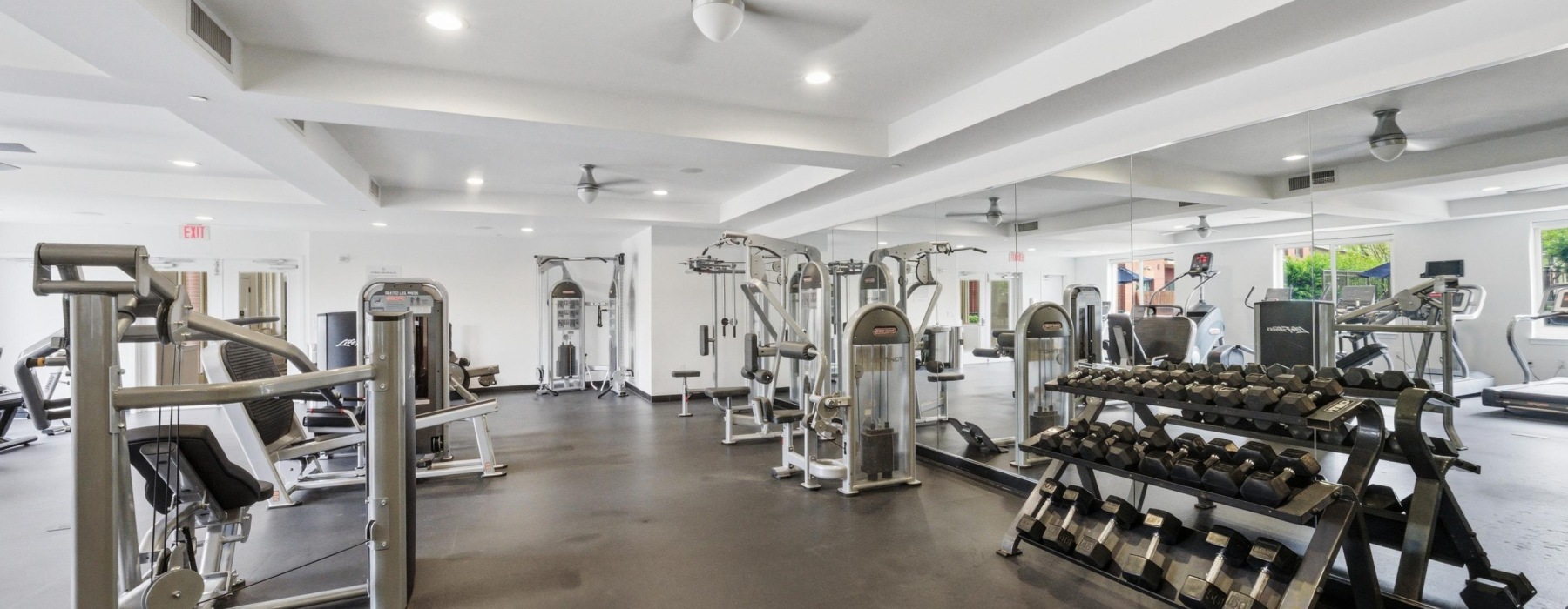 Fitness center with weight station and workout machines