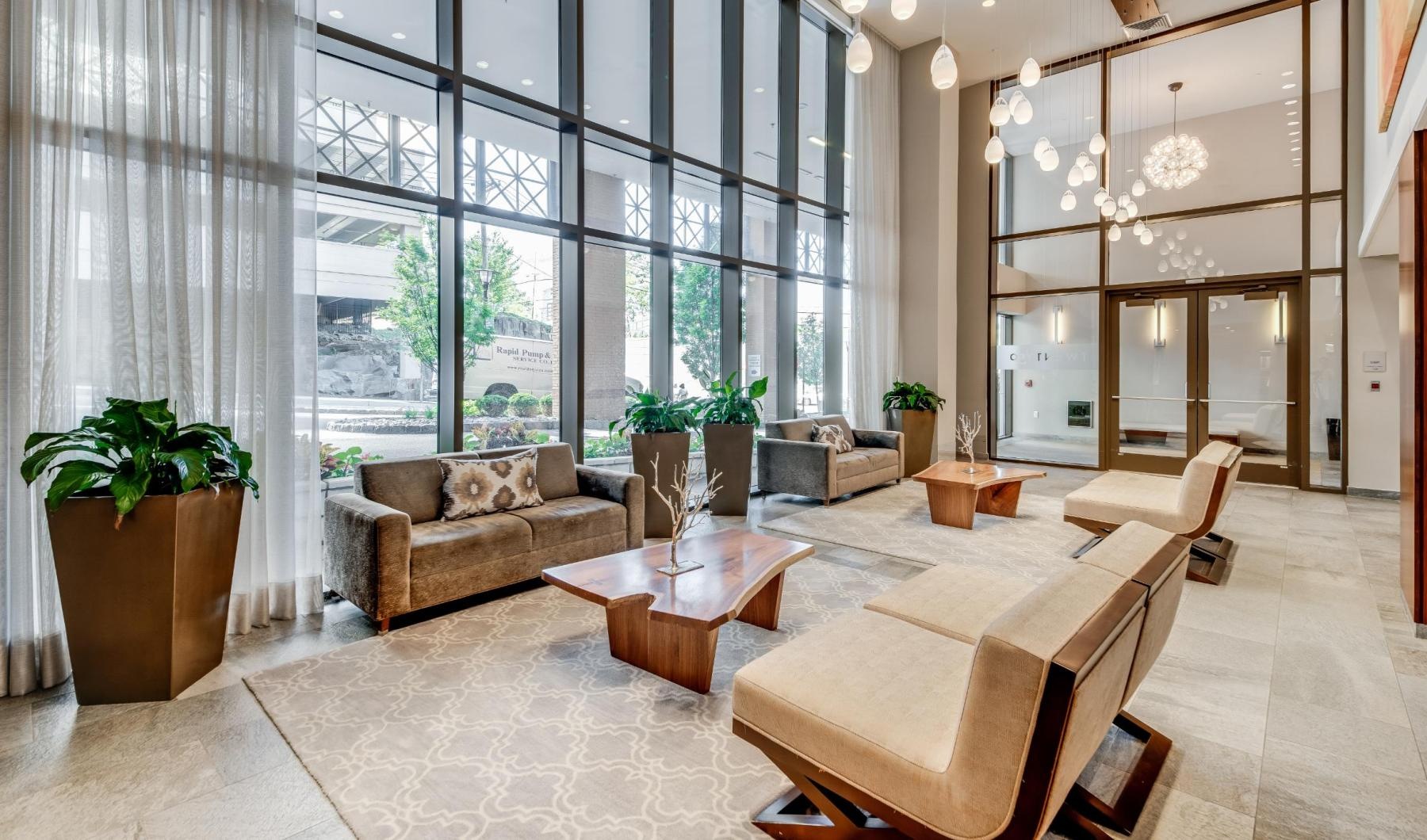 a lounge with a couch and chairs