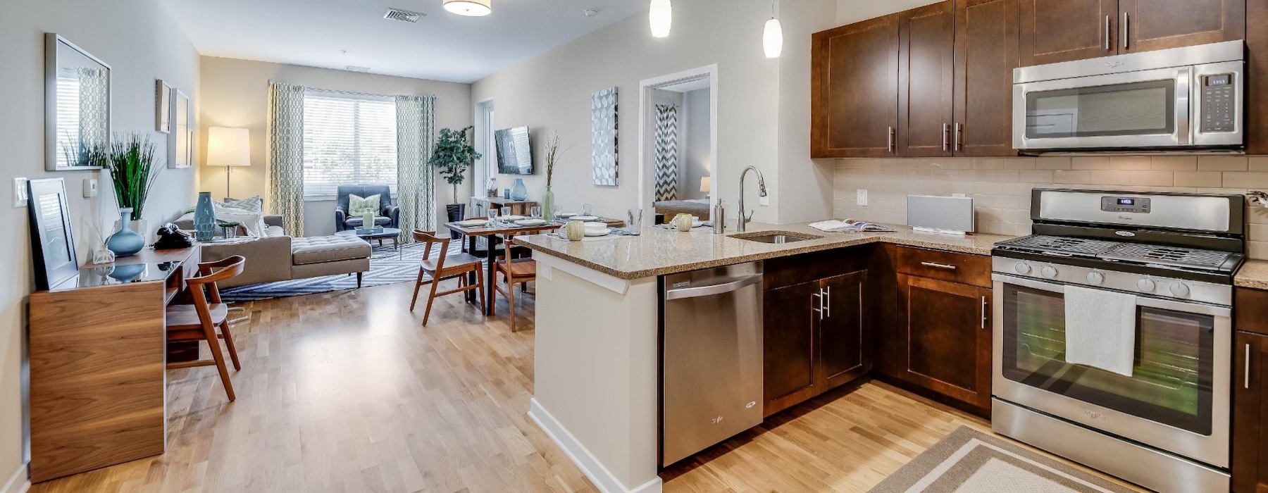 a kitchen with wooden floors