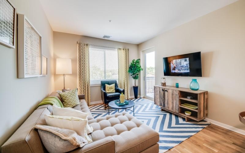 a living room with a couch and a tv